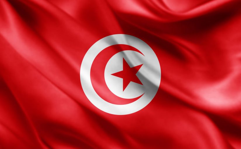Tunesisk flag der blafrer i vinden
